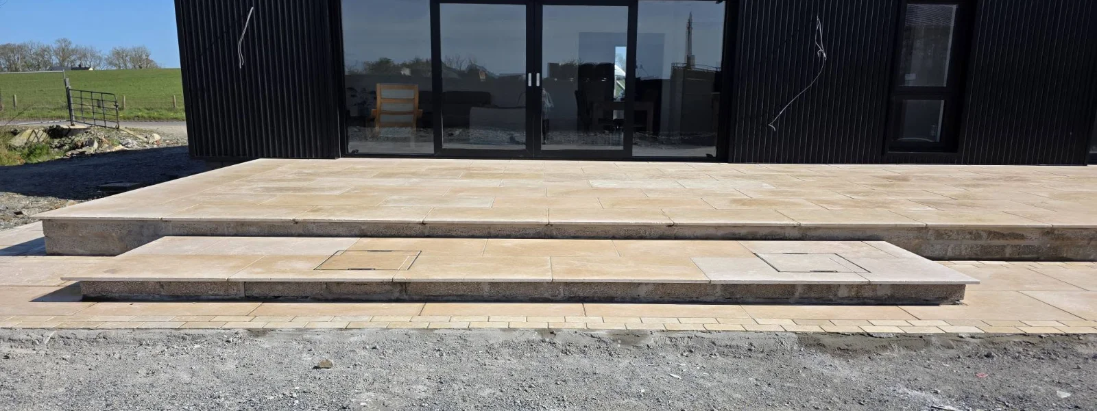 Wide paved steps leading up to the terrace
